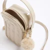 Beige quilted pom pom cross body bag