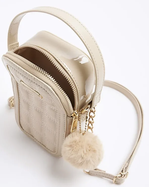 Beige quilted pom pom cross body bag