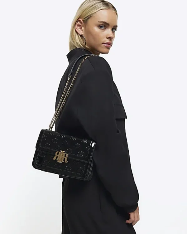 Black embossed RI lock shoulder bag