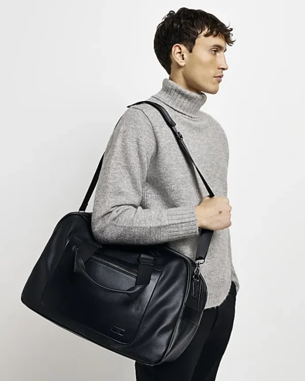 Black faux leather holdall