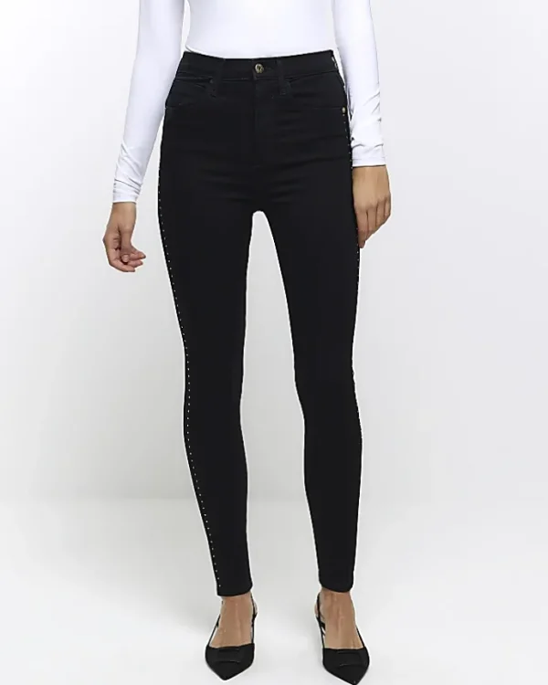 Black high waisted stud skinny jeans