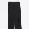 Black pleated wide leg trousers