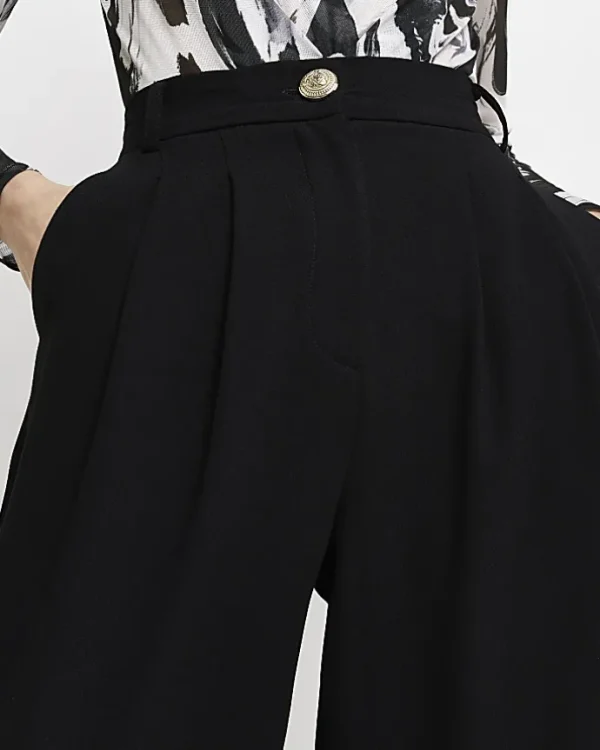 Black wide leg pleated trousers