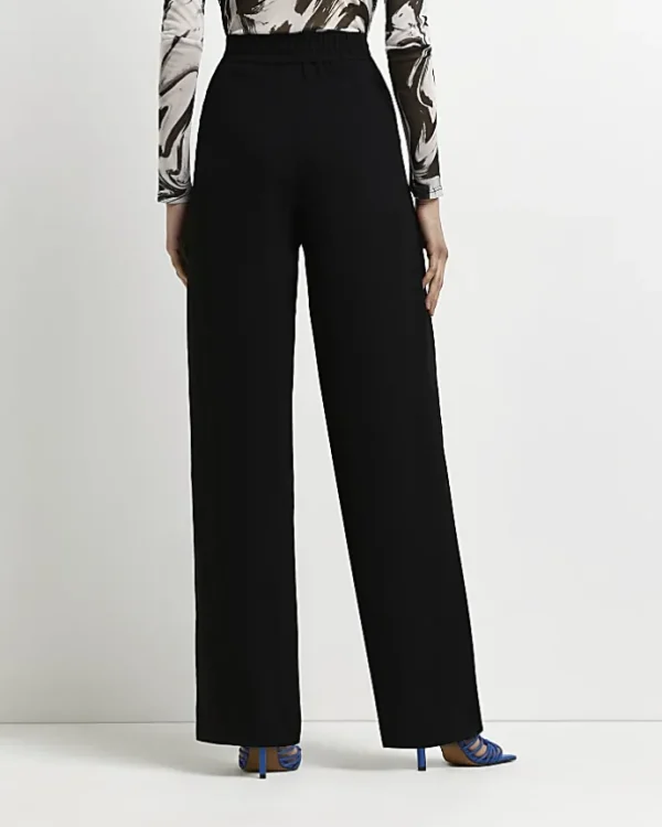 Black wide leg pleated trousers