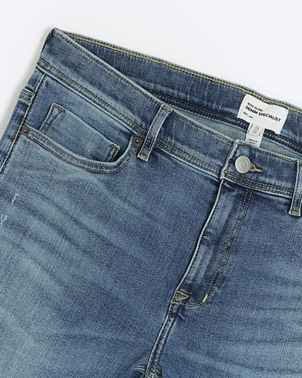 Blue super skinny spray on washed jeans