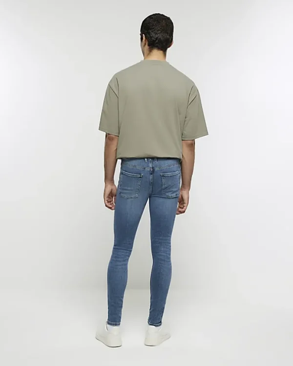 Blue super skinny spray on washed jeans