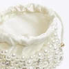 Cream pearl embellished handbag