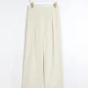 Cream pleated wide leg trousers