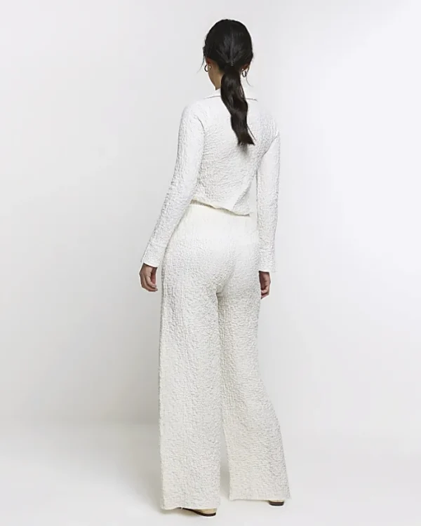 Cream textured wide leg trousers