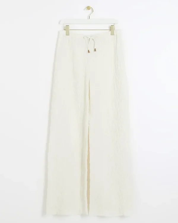 Cream textured wide leg trousers