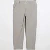 Ecru tapered fit plisse smart trousers