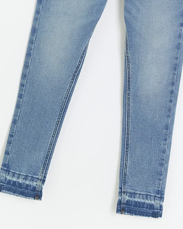 Girls denim let down hem skinny jeans