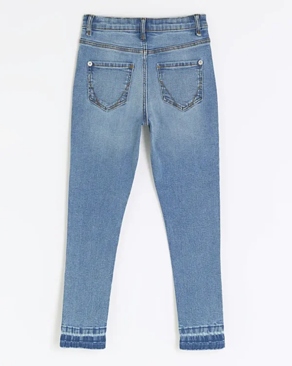 Girls denim let down hem skinny jeans