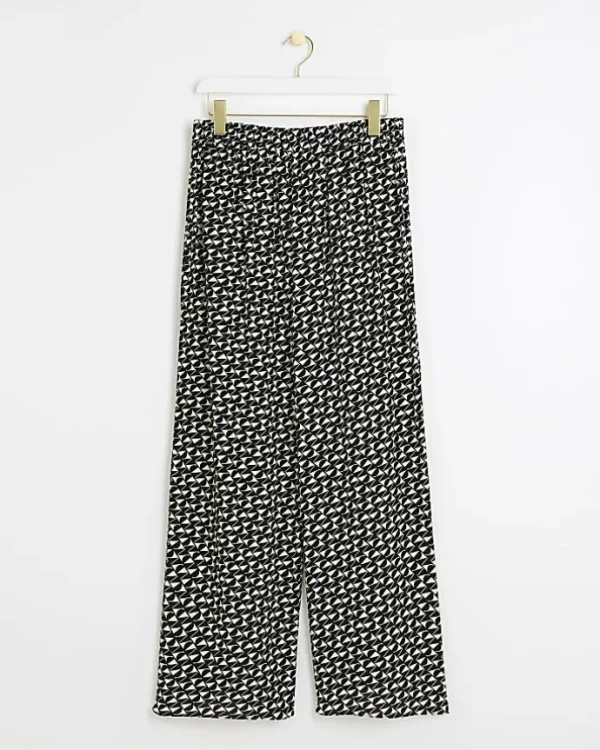 Petite black geometric wide leg trousers