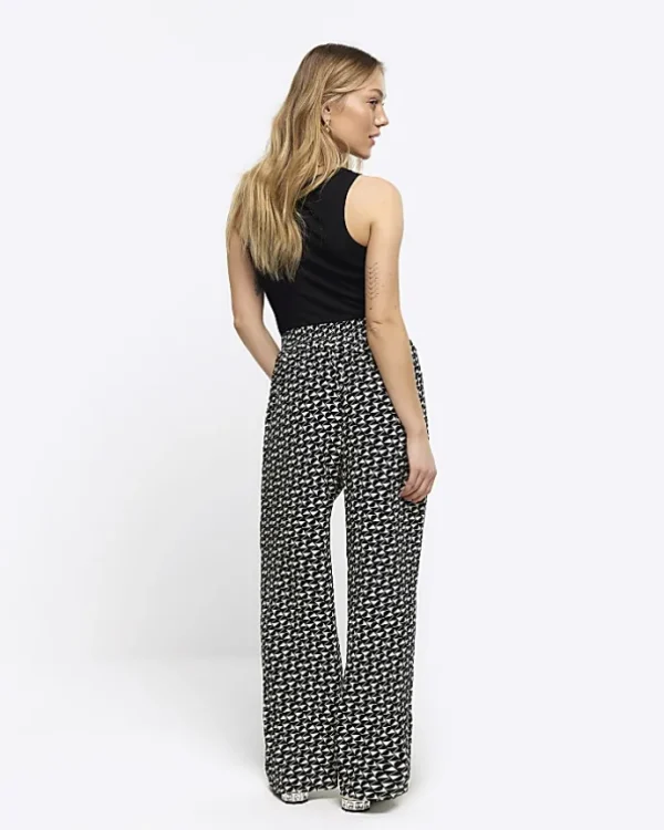 Petite black geometric wide leg trousers