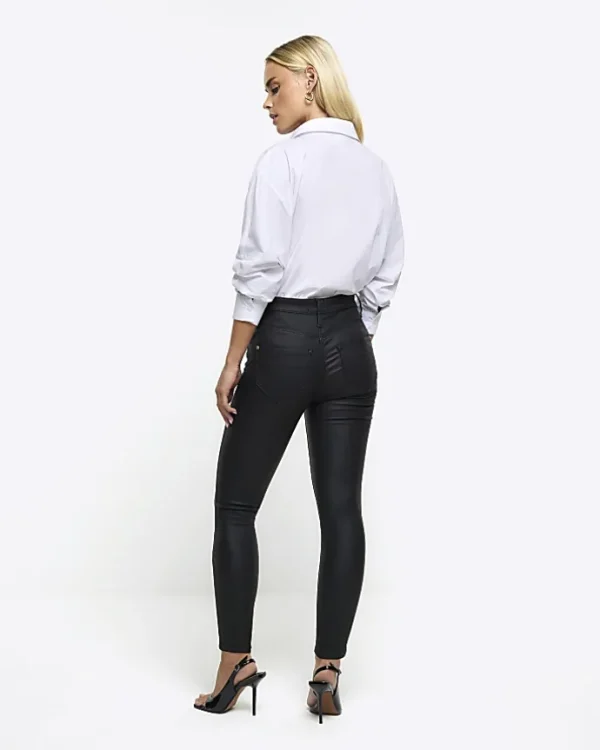 Petite black skinny fit coated jeans