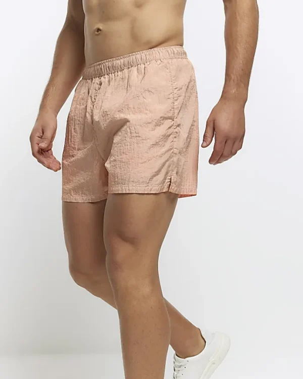 Pink elasticated swim shorts