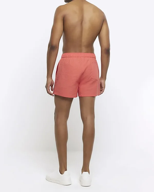 Pink regular fit seersucker swim shorts