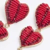 Red beaded heart drop earrings