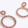 Red open circle drop earrings