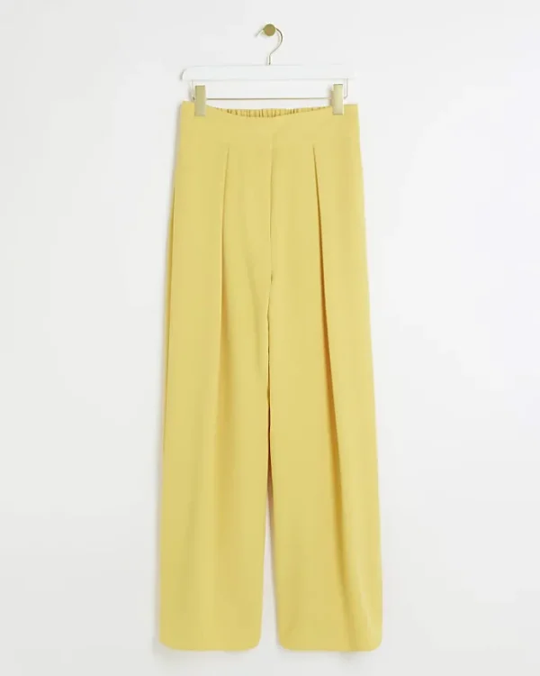 Yellow pleated wide leg trousers