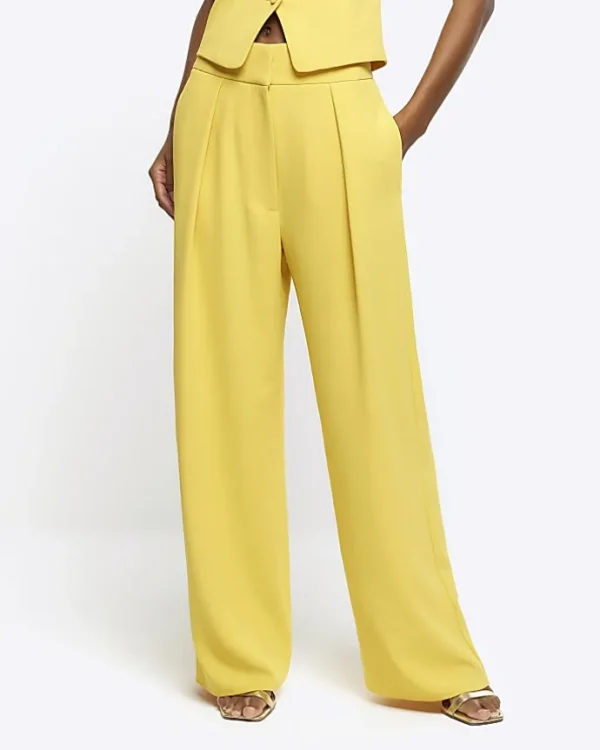 Yellow pleated wide leg trousers